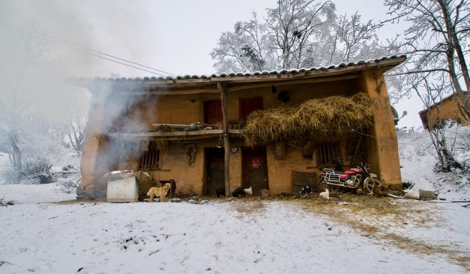 What a house looks like in rural Yunnan province, one of the poorest regions in China. The village had no running water, and was only recently connected to the grid.