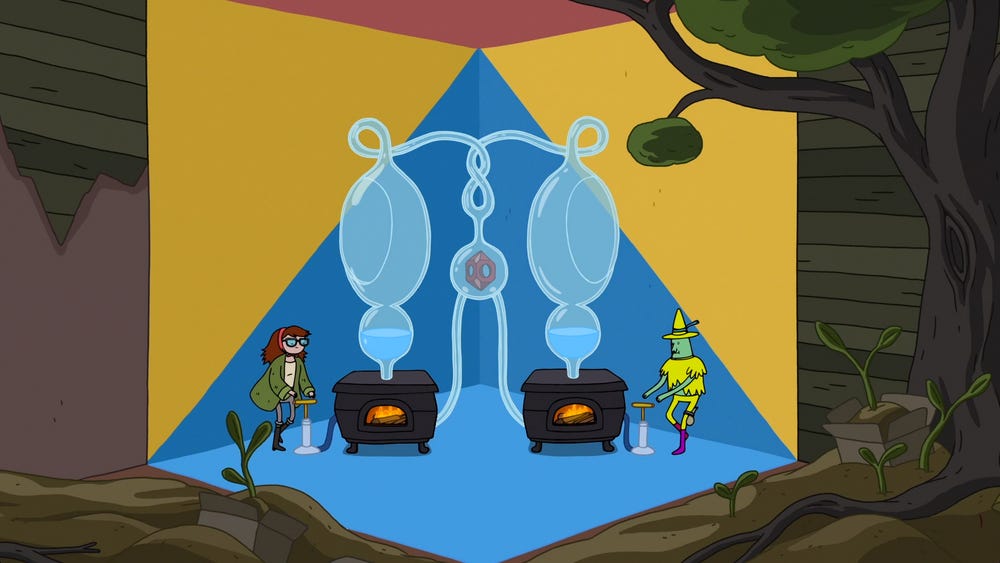 A screenshot from the episode. In a dirt-filled room, a space has bright colours decorating the walls, floor, and ceiling, with a complicated system of glass beakers above two furnaces, in the middle of which is a red helmet. On either side, Magic Man and Betty use pumps to fire up the furnaces.