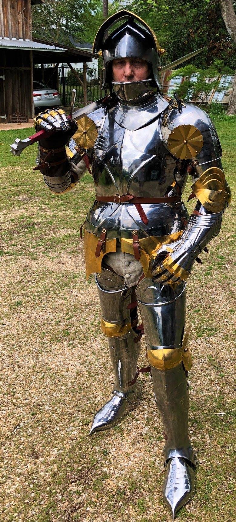 Brian R. Price in a full head-to-toe harness of medieval armour.