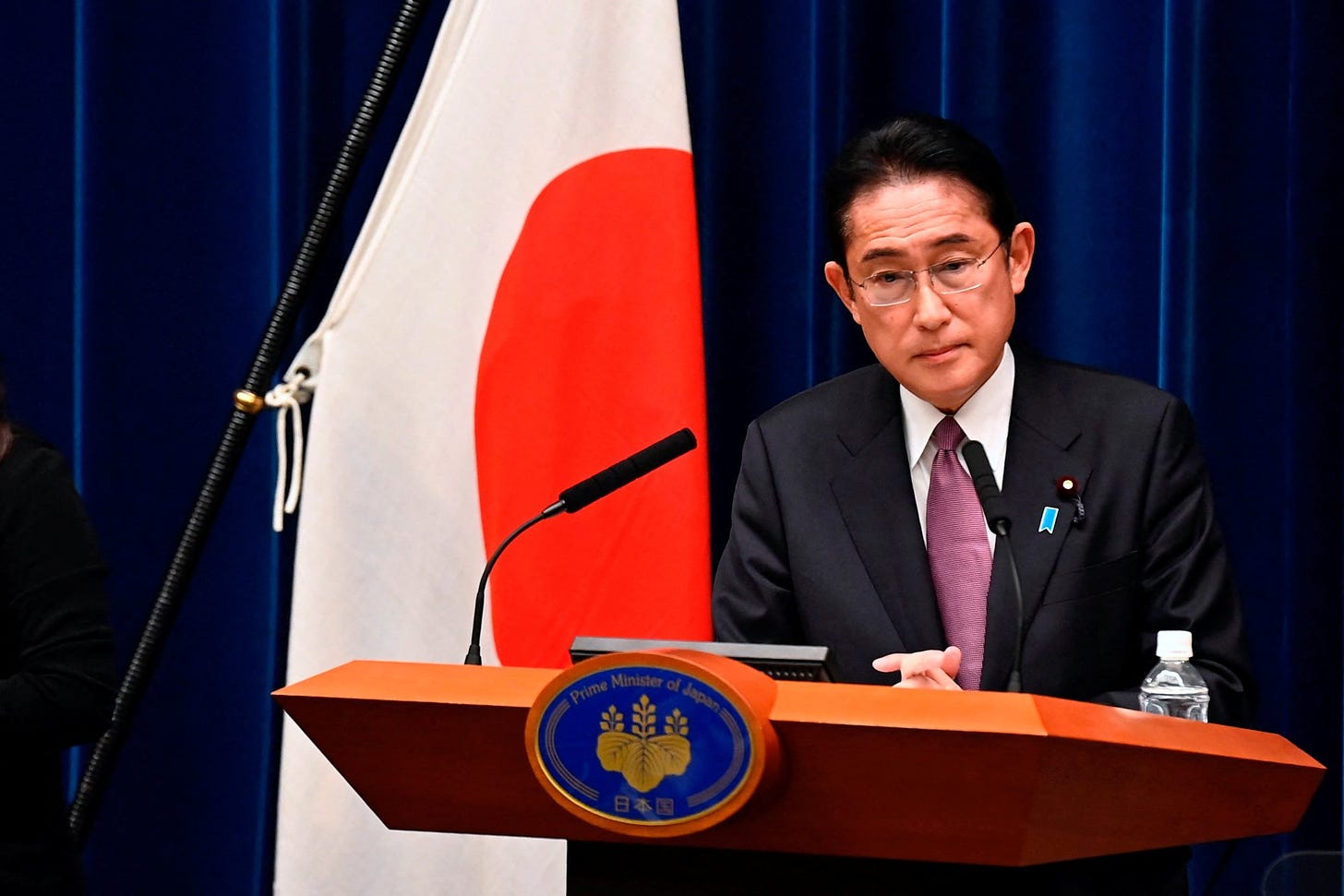 Japanese Prime Minister Fumio Kishida taking questions at a news conference in Tokyo on Friday after the cabinet approved new defence and national security strategies. Photo: Reuters
