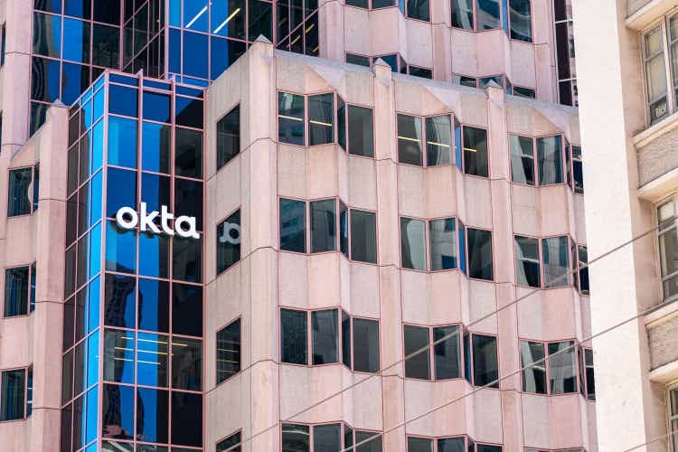 Okta sign, logo on headquarters building of identity and access management software company.