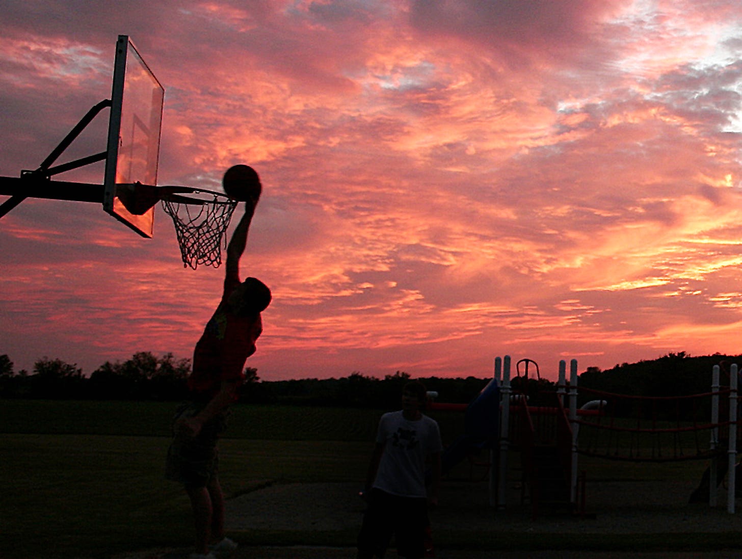 A typical Indiana scene plays out at Kennard Elementary School as local kids test their skills on the playground basketball court. The striking sunset makes a nice backdrop for this scene, which could’ve been cut from the popular movie Hoosiers itself. 