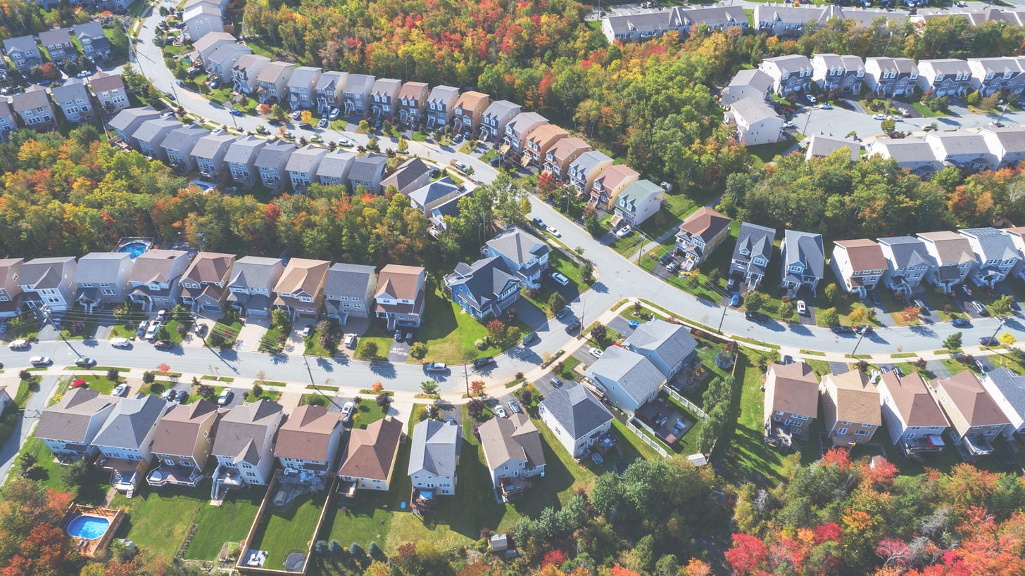 aerial image of houses with trees