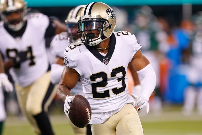 New Orleans Saints' Marshon Lattimore (23) runs back a fumble recovery during the first half of the team's preseason NFL football game against the New York Jets on Saturday, Aug. 24, 2019, in East Rutherford, N.J. (AP Photo/Noah K. Murray)