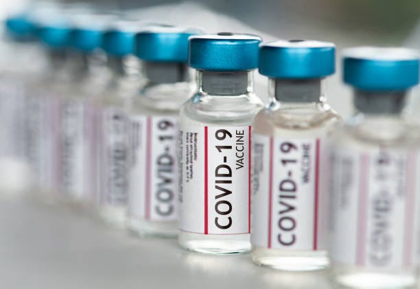 covid-19 coronavirus vaccine vials in a row macro close up - covid stock pictures, royalty-free photos & images