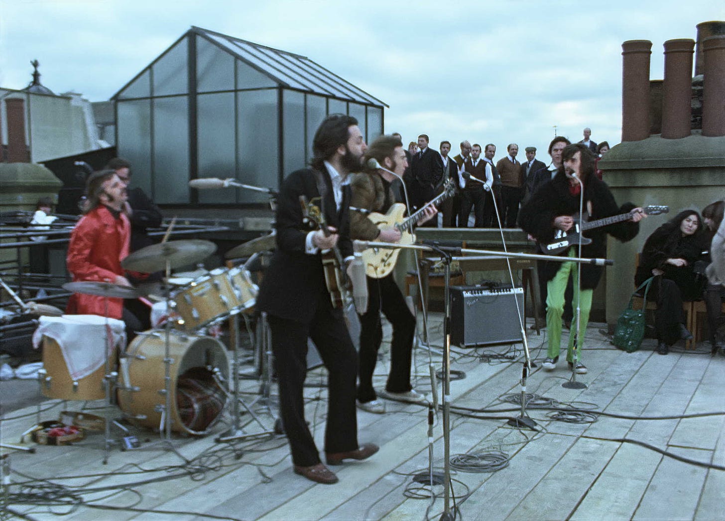 Ringo, Paul, John and George performing on the rooftop