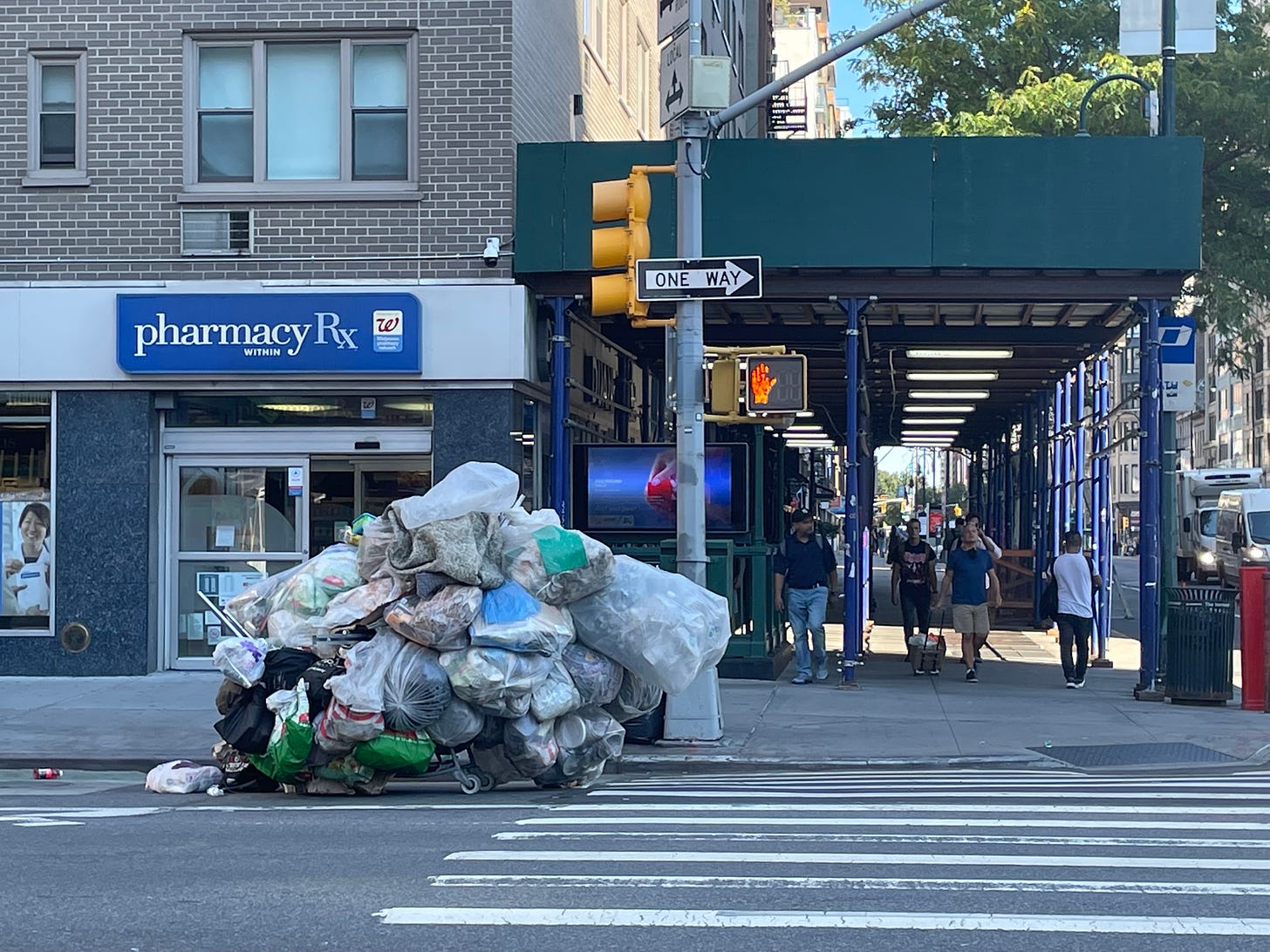 A cart piled high with trash bags in New York City