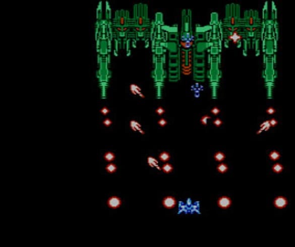 A screenshot of a boss fight from Recca, with waves of unblockable shots being fired at your ship.