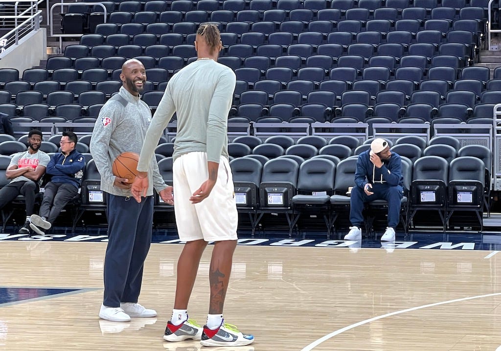Myles Turner warms up with assistant coach Lloyd Pierce before each game.