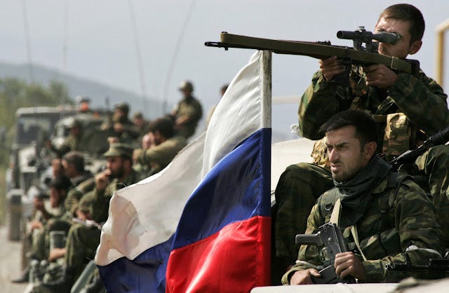 Russian%20soldiers%20move%20atop%20of%20their%20APCs%20on%20August%2011,%202008%20in%20the%20village%20of%20Zemo%20Nikozi,%20some%2015%20kilometers%20from%20Tskhinvali.%20%C2%A9%20AFP