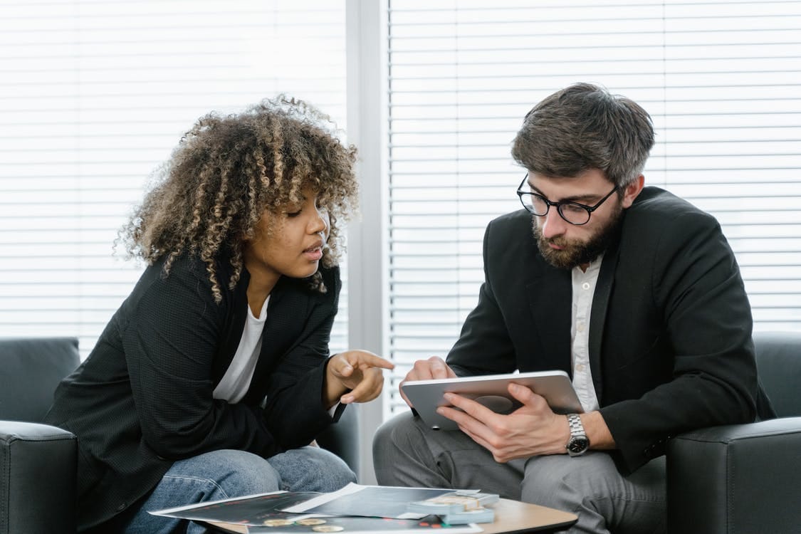 Free Man and Woman Having a Meeting Stock Photo