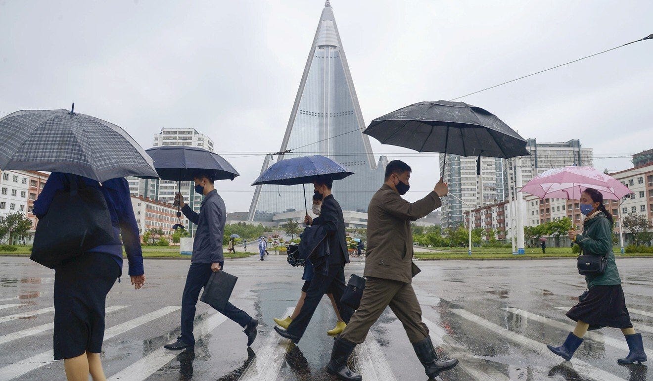 Pedestrians wear protective face masks in Pyongyang, North Korea. Photo: Reuters