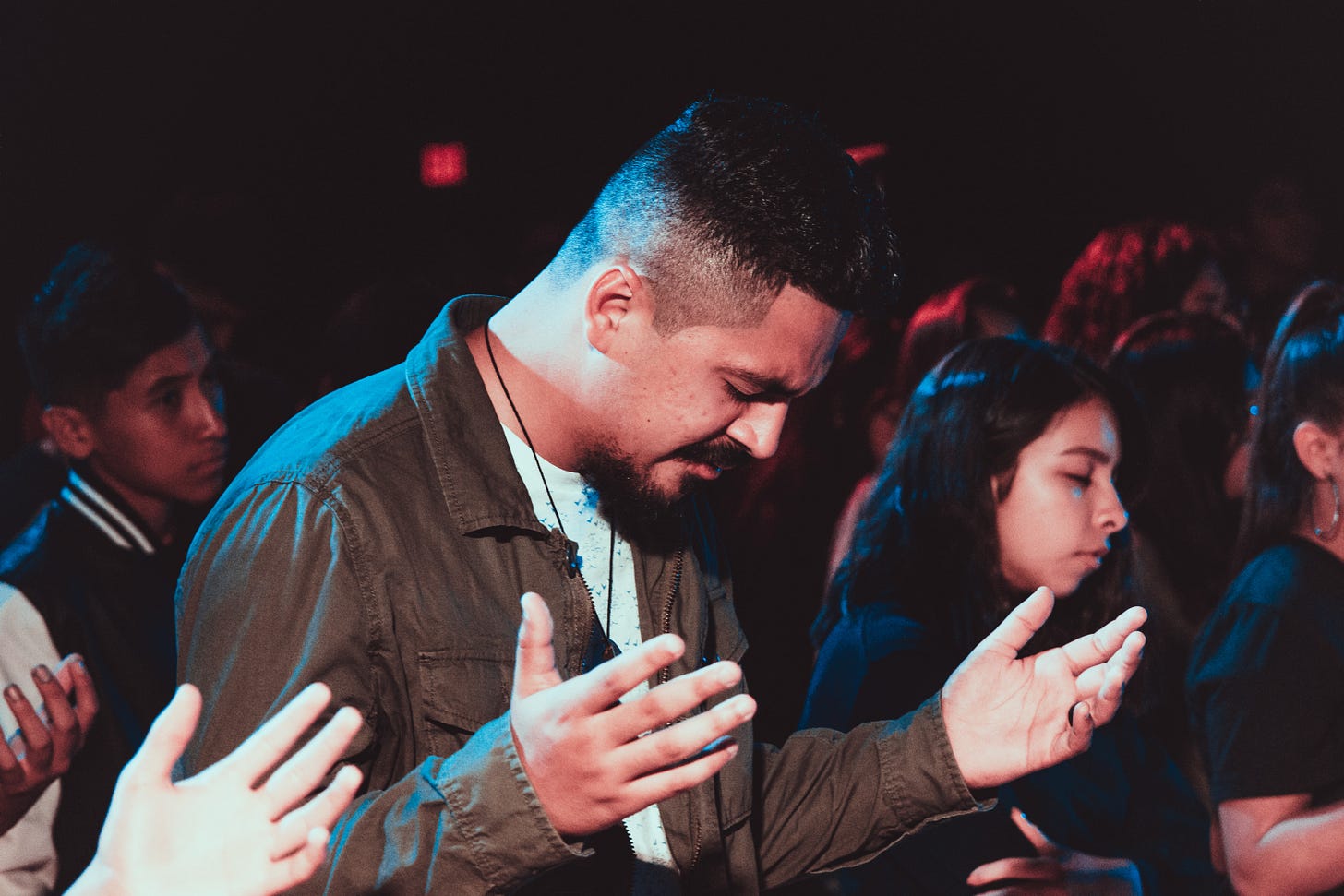People in a church meeting worsipping/praying People in a church meeting worsipping/praying