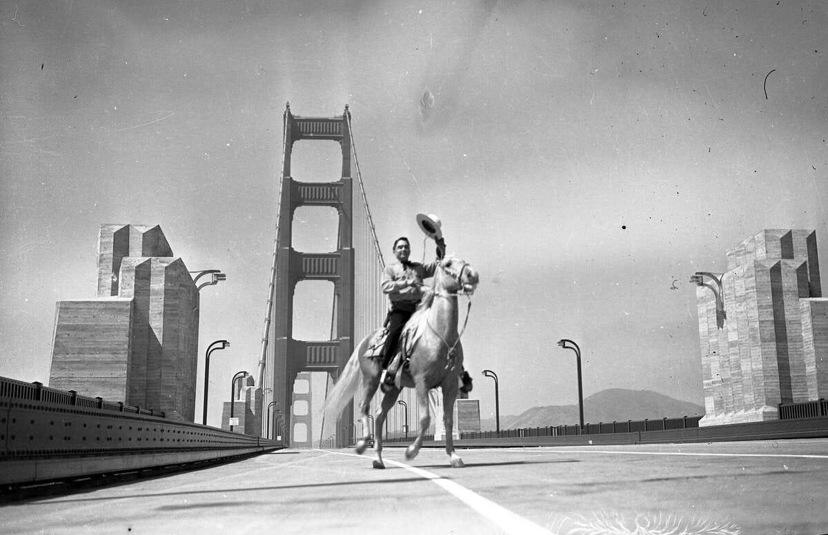 A man on horseback crosses the Golden Gate Bridge sometime before its official opening on May 27, 1937. This could be the first person to cross the bridge on a horse. 