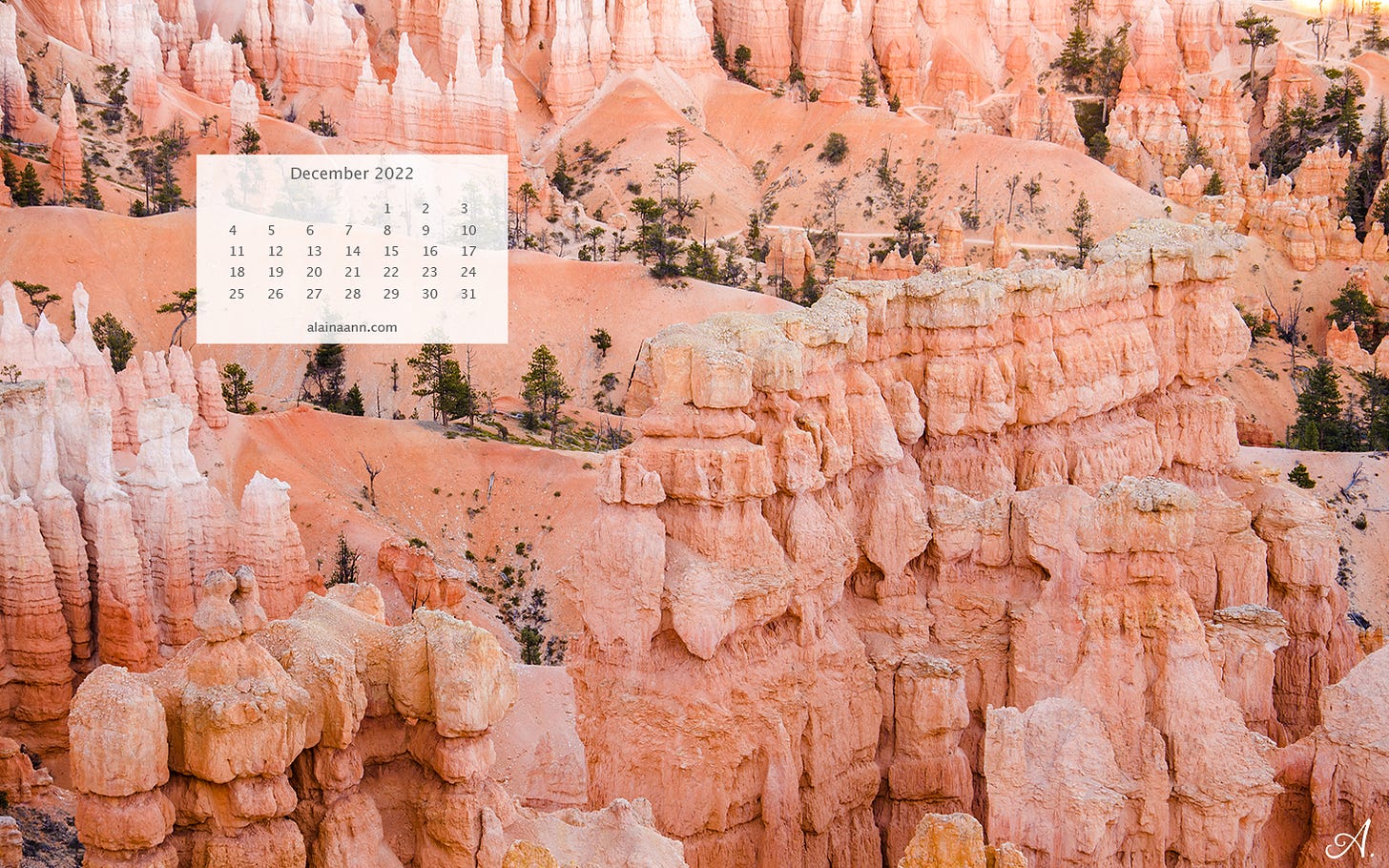 December calendar overlaying an image of orange hoodoo rock formations.