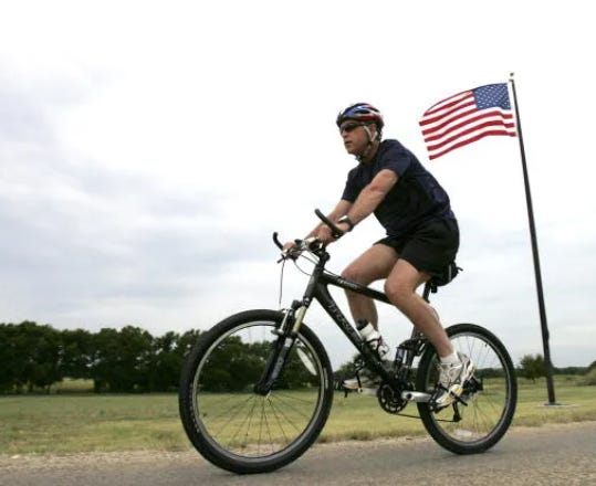 Former President George W. Bush on a mountain bike
