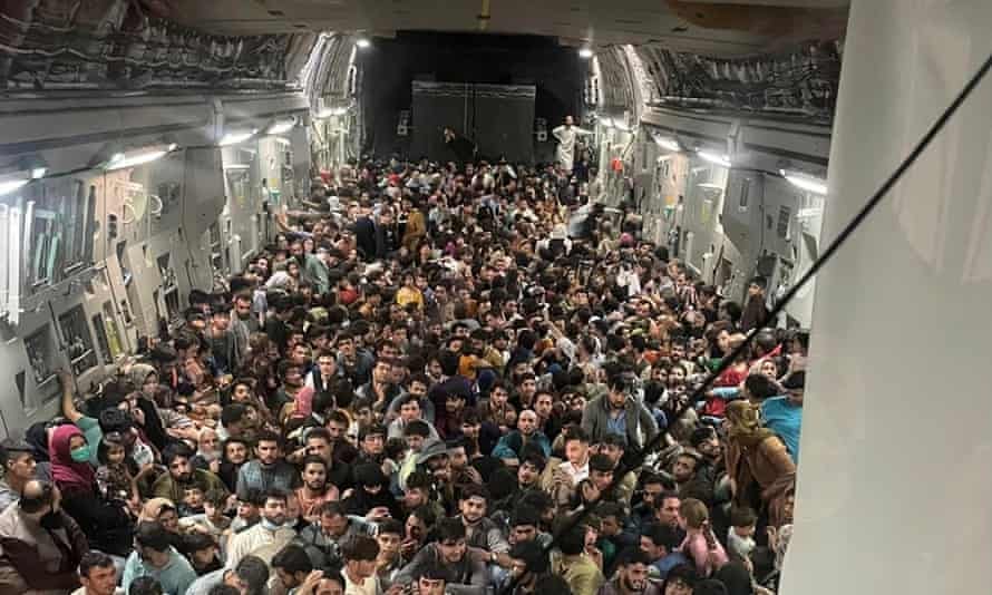 Afghanistan: striking image shows 640 people fleeing Kabul in packed US  military plane | Afghanistan | The Guardian