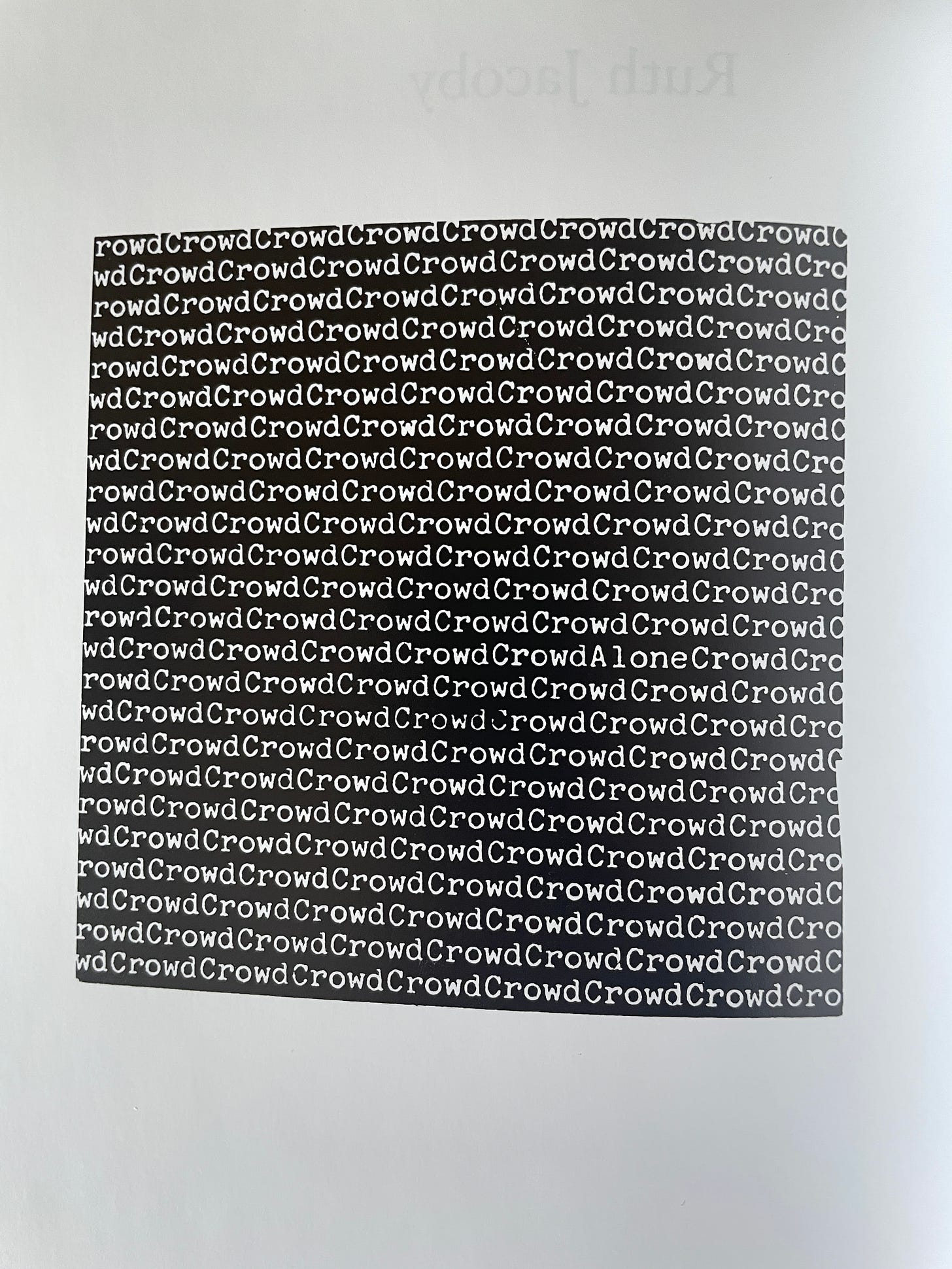 A black square with the word “Crowd” repeated in white text throughout, with a single instance of the word “Alone” hidden within it.