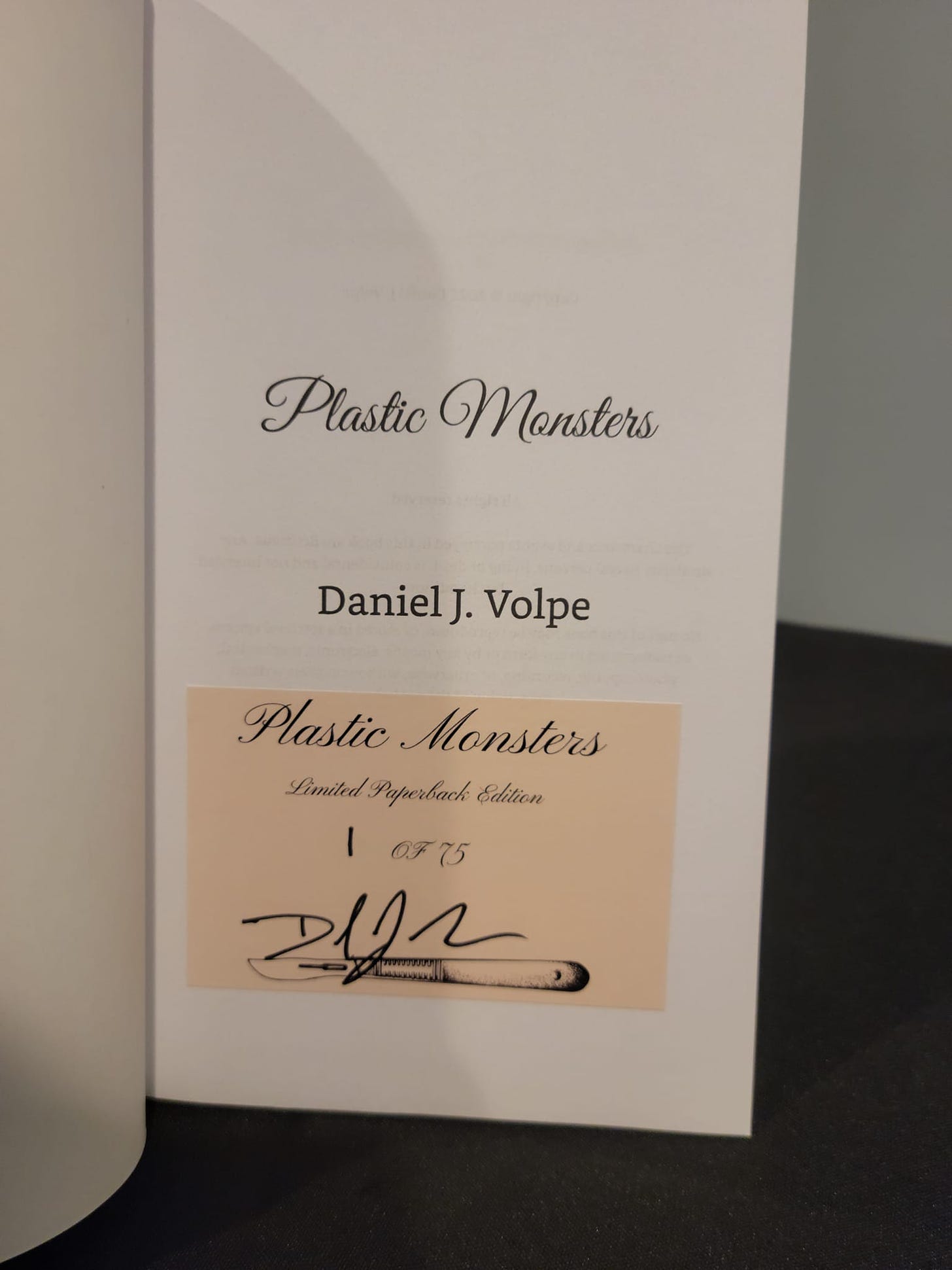 May be an image of text that says 'Plastic Monsters DanielJ. Volpe Plastic Monsters Limited Paperbck Edition I 0775 zழா'