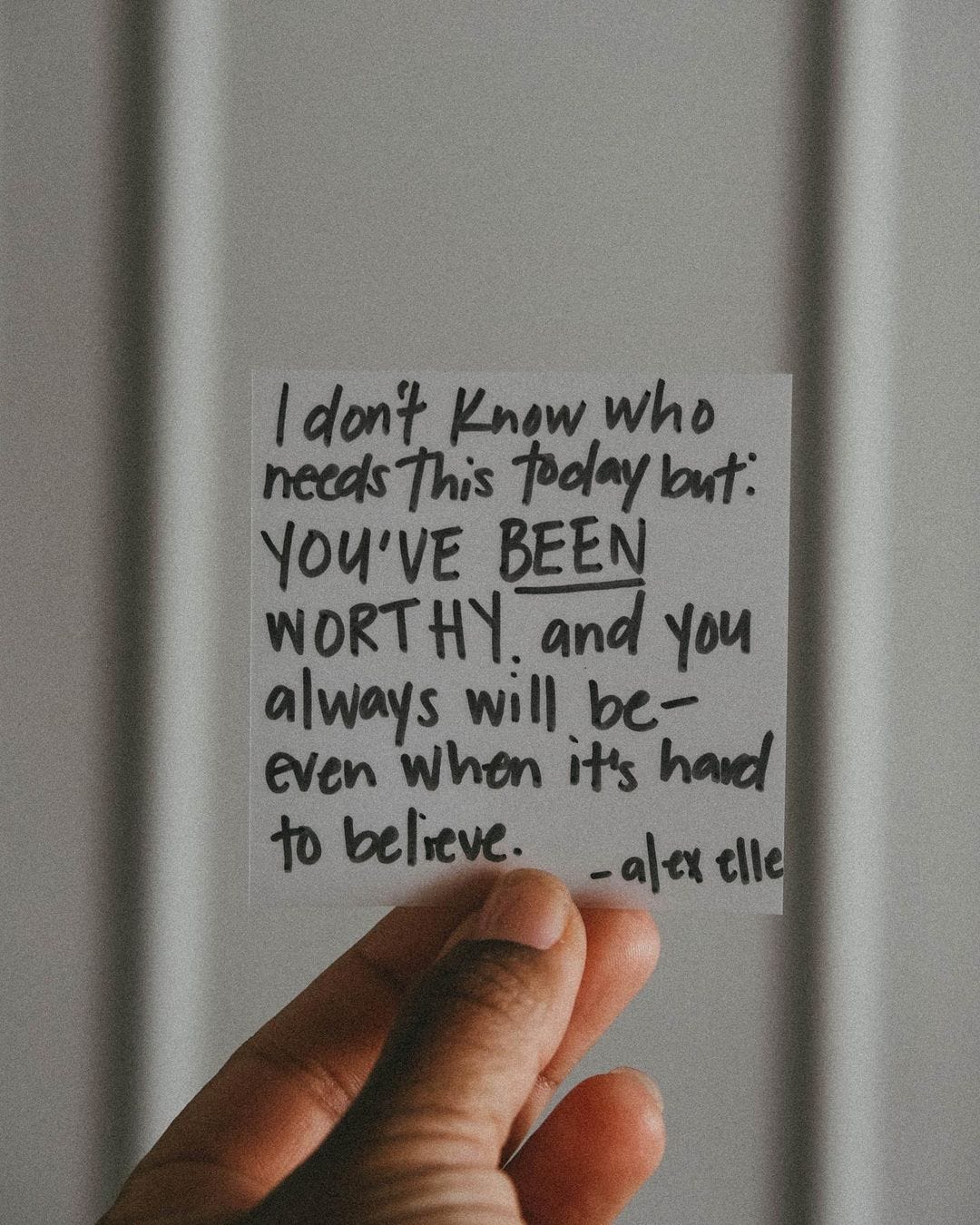 A handwritten post-it note that reads: "I don't know who needs this today but: YOU'VE BEEN WORTHY. and you always will be – even when it's hard to believe." - alex elle