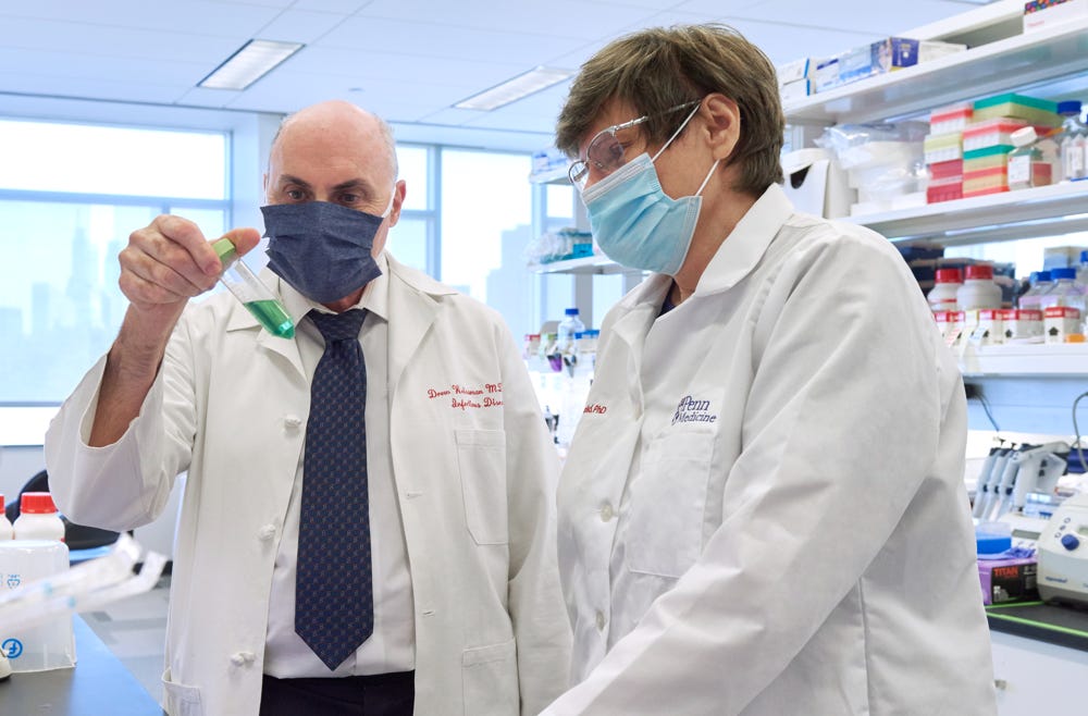 Weissman and Kariko working in their lab at Penn