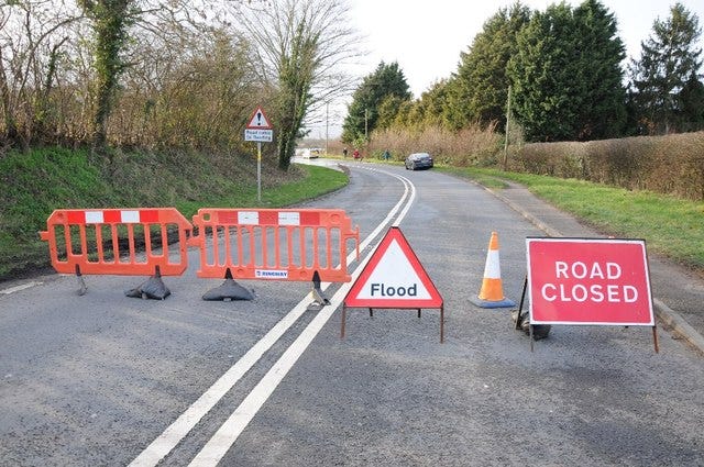 Road closure signs for a flood