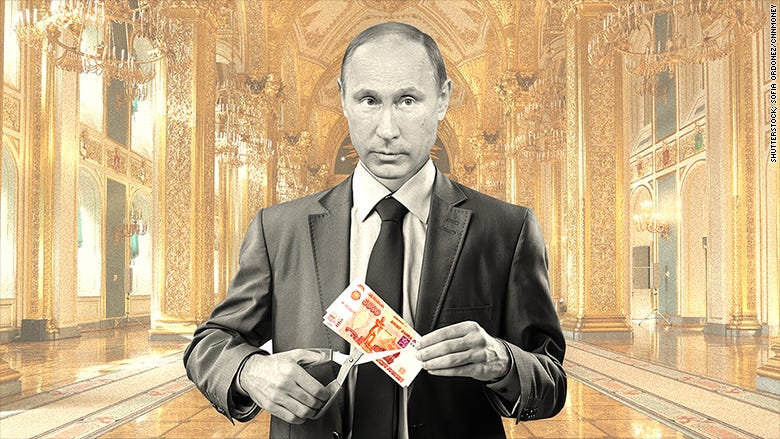 Putin gets tough, slashes own salary as economy tanks