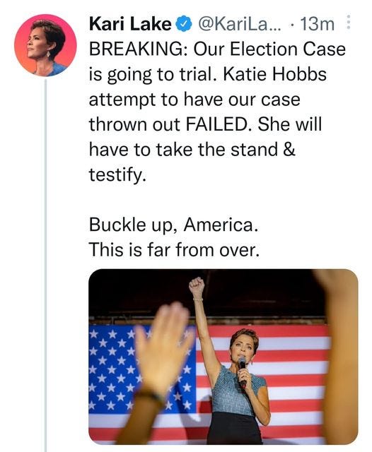 May be an image of 3 people and text that says 'Kari Lake @KariLa... 13m BREAKING: Our Election Case is going to trial. Katie Hobbs attempt to have our case thrown out FAILED. She will have to take the stand testify. Buckle up, America. This is far from over.'