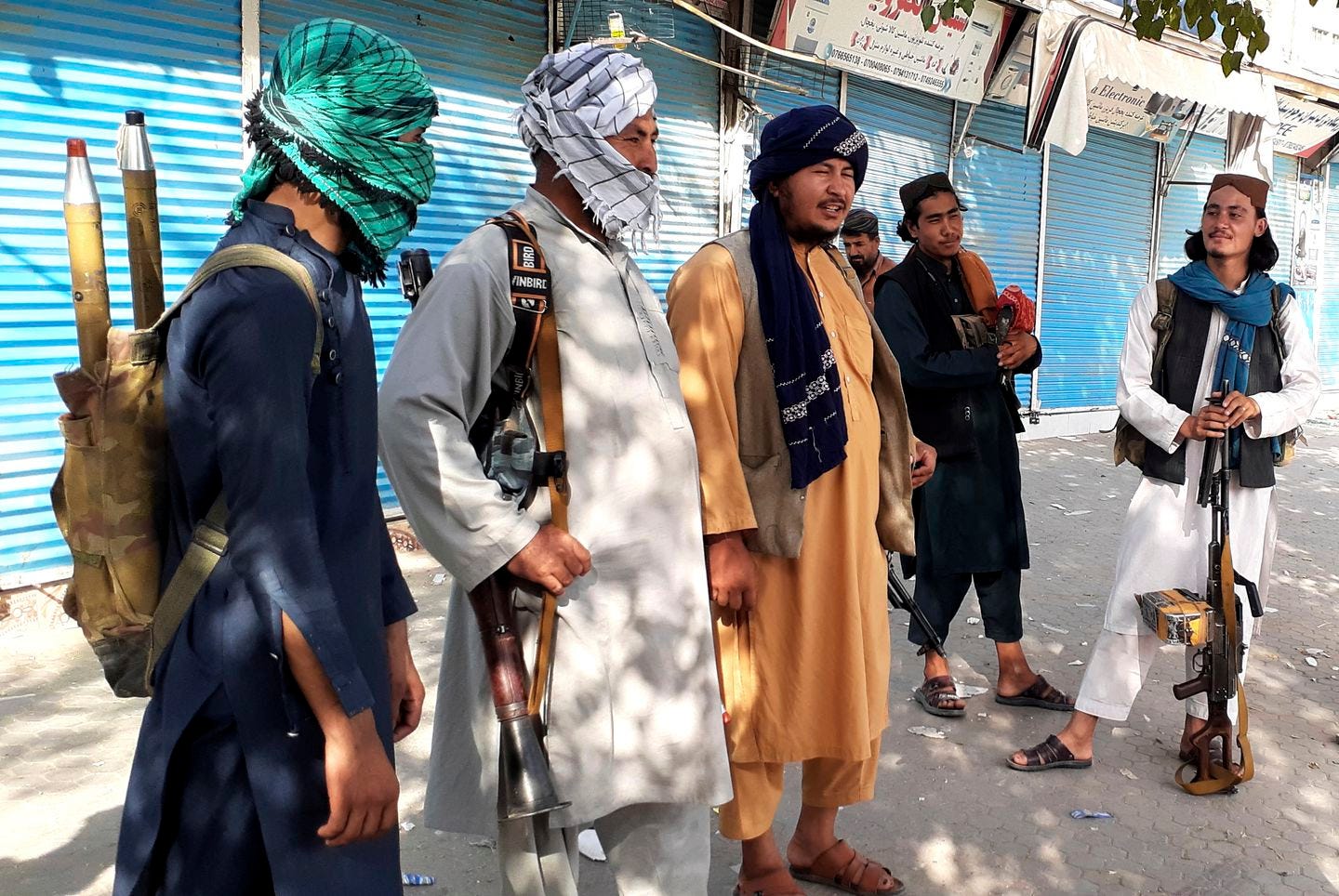 Taliban fighters stood guard in Kunduz city, northern Afghanistan on Monday. The militants have ramped up their push across much of Afghanistan in recent weeks, turning their guns on provincial capitals after taking district after district and large swaths of land in the mostly rural countryside.