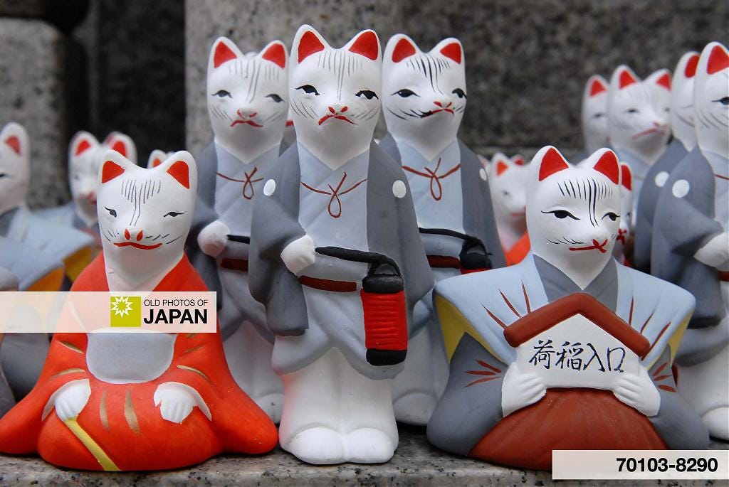 Figures of dressed up foxes at Fushimi Inari Taisha in Kyoto