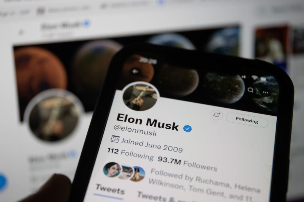 Photo of Elon Musk's Twitter profile on a phone. (Matt Cardy / Getty Images)