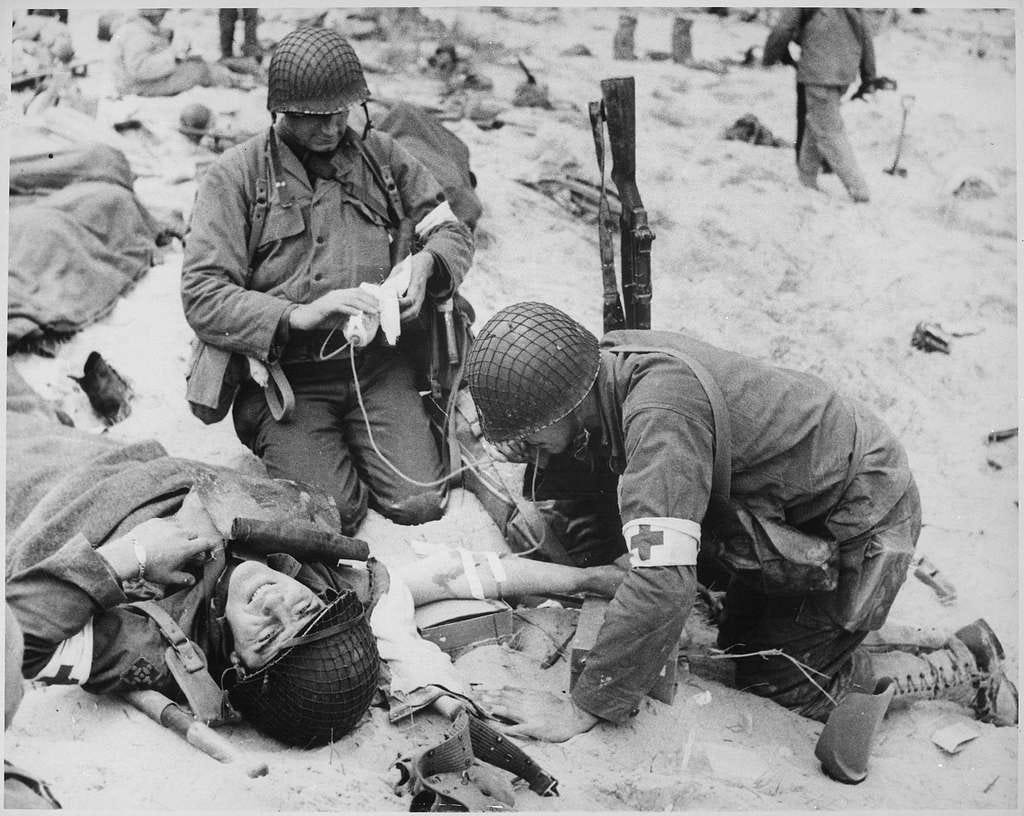 Medics helping injured soldier in France, 1944 - NARA - 535973 - PICRYL  Public Domain Image