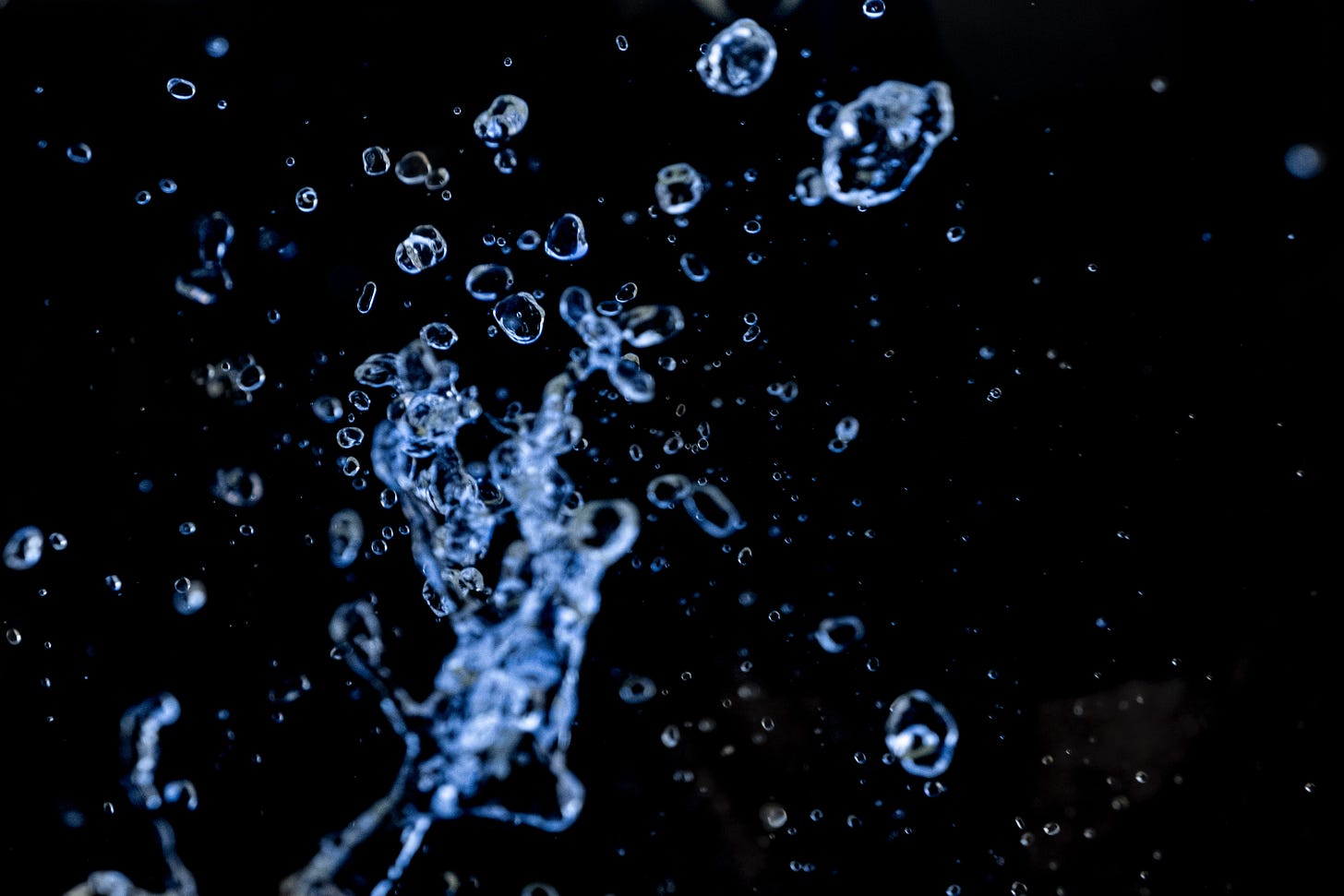 water splashing onto a blue background.