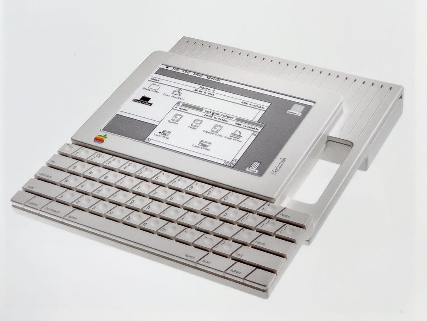 "BookMac"—an integrated portable with a central flat screen, attached keyboard and handle