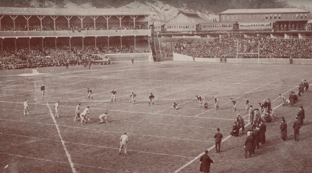 A team prepares to attempt a free kick at the Polo Grounds in 1903, the only year the field had the partial checkerboard markings.
