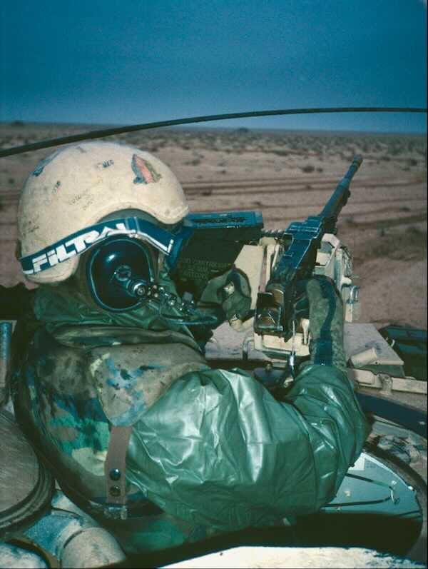 My loader at his station on my M1A1 tank during Battle of 73 Easting