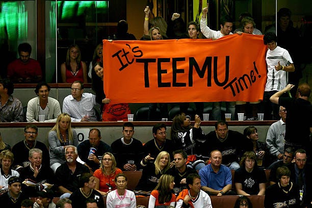 Fans of Teemu Selanne of the Anaheim Ducks hold a sign in celebration of the Ducks' victory over the Ottawa Senators 6-2 during Game Five of the n...