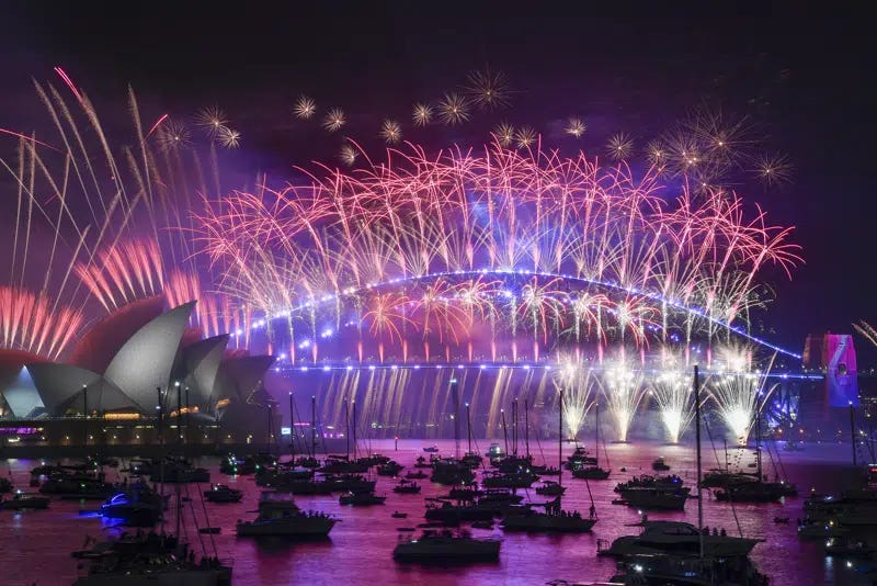 Fireworks explode over the Sydney Opera House and Harbour Bridge as New Year celebrations begin in Sydney, Australia, Sunday, Jan. 1, 2023. (Bianca De Marchi/AAP Image via AP)