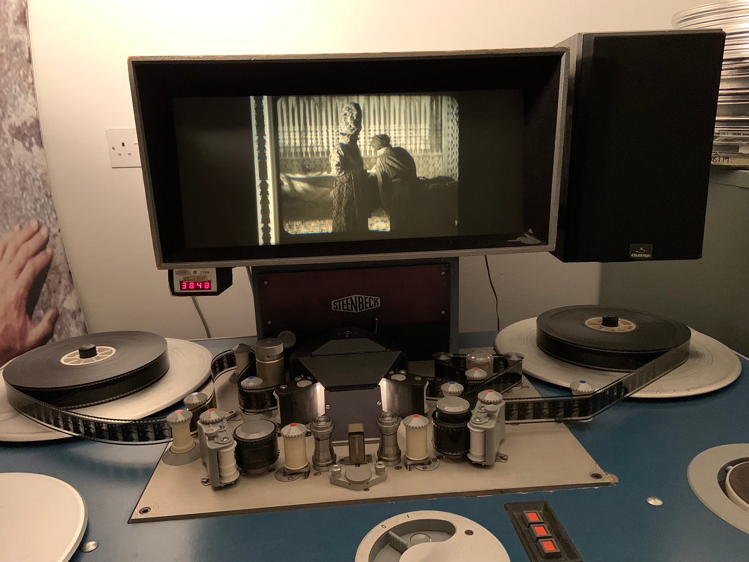 photo of a Steenbeck editing machine playing 35 mm reels