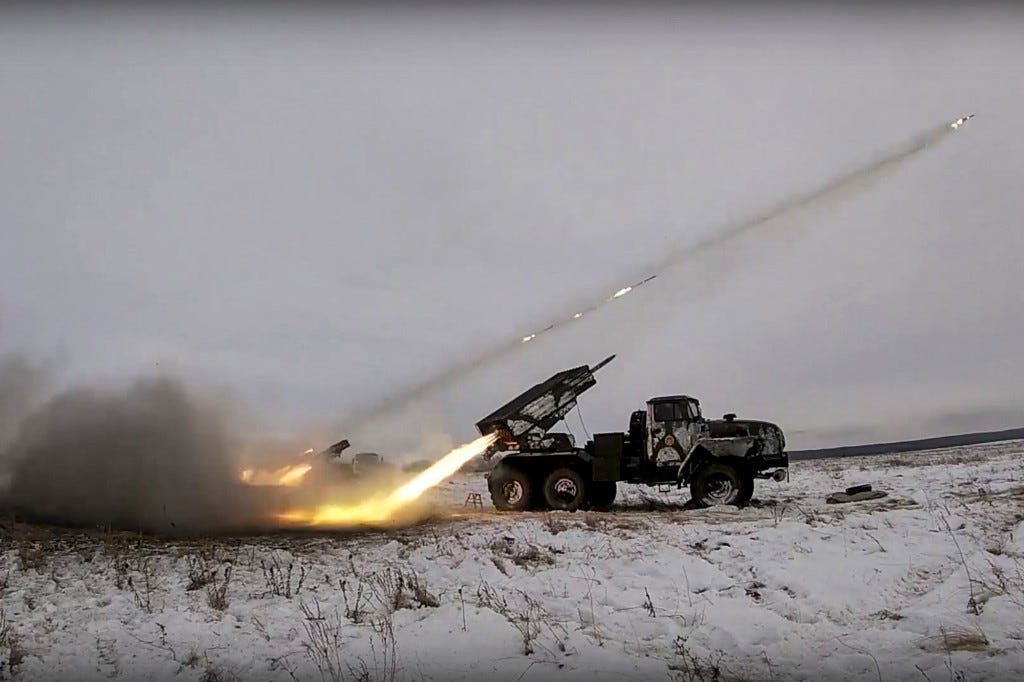 A handout still image took from handout video made available by the Russian Defence ministry press service on 16 December 2021 shows Russian BM-21 'Grad' a Soviet truck-mounted 122 mm multiple rocket launchers shoot during military drills near Orenburg, Russia
