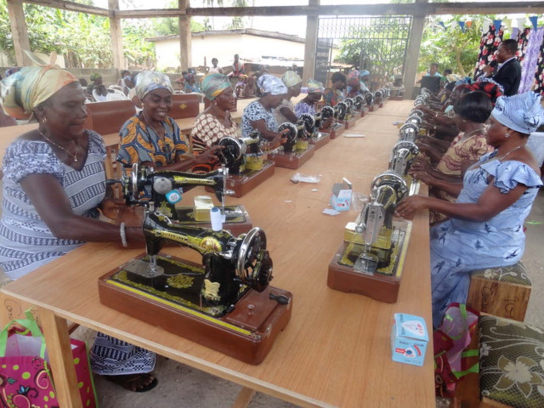 Malawi women learning to sew.