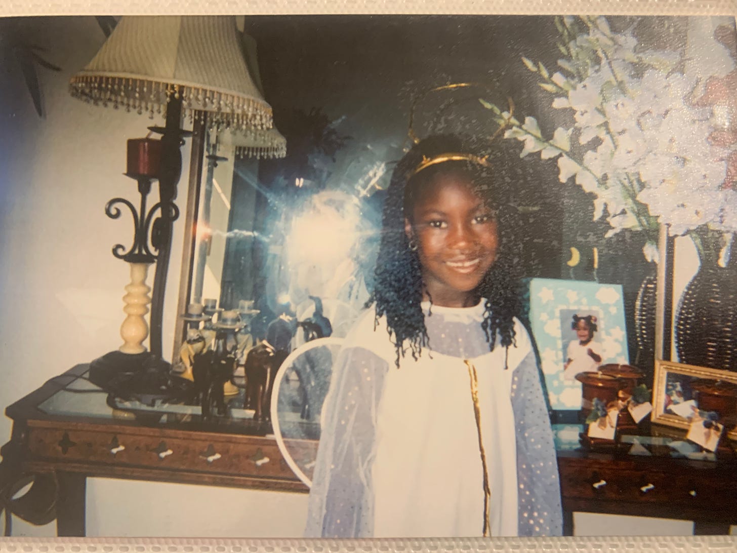 Ismatu Gwendolyn pictured as a child in an angel costume