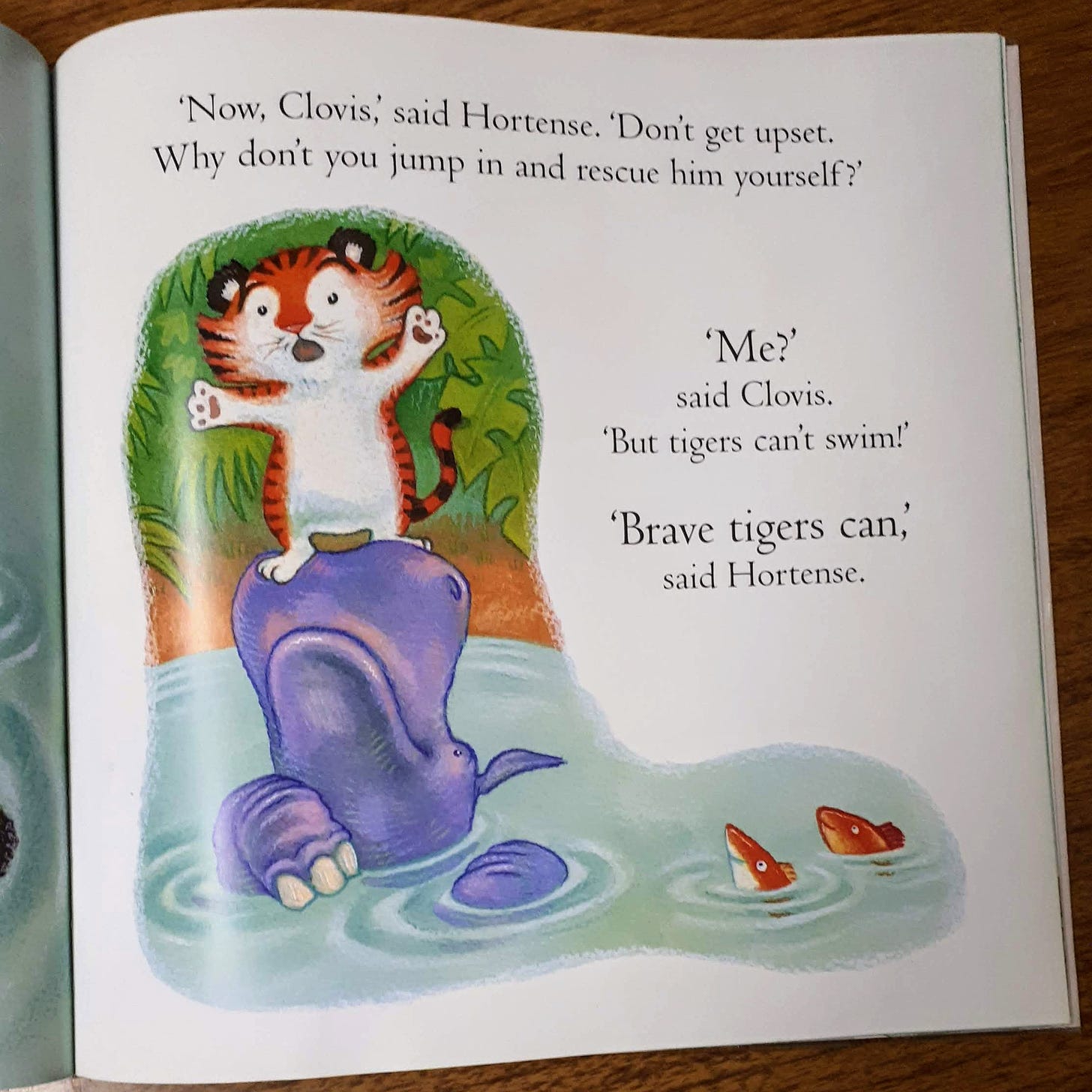 A page from a children's book with dialogue between a tiger named Clovis and a hippo named Hortense.