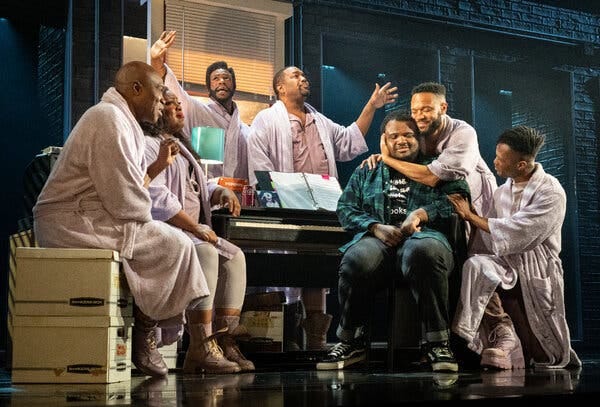 The six actors surrounding Spivey, seated in jeans, embody his competing thoughts, from left: James Jackson Jr., L Morgan Lee, Antwayn Hopper, John-Andrew Morrison, Jason Veasey and John-Michael Lyles.