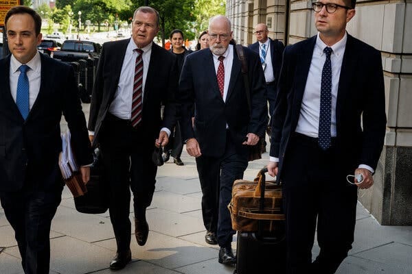 John H. Durham, center right, the special counsel examining the origins of the Russia investigation, will deliver a final report this year. Attorney General Merrick B. Garland will ultimately decide whether to make its findings public.
