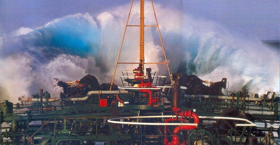 A giant wave breaking over the bow of the Esso Nederland II in the Agulhas Current.
