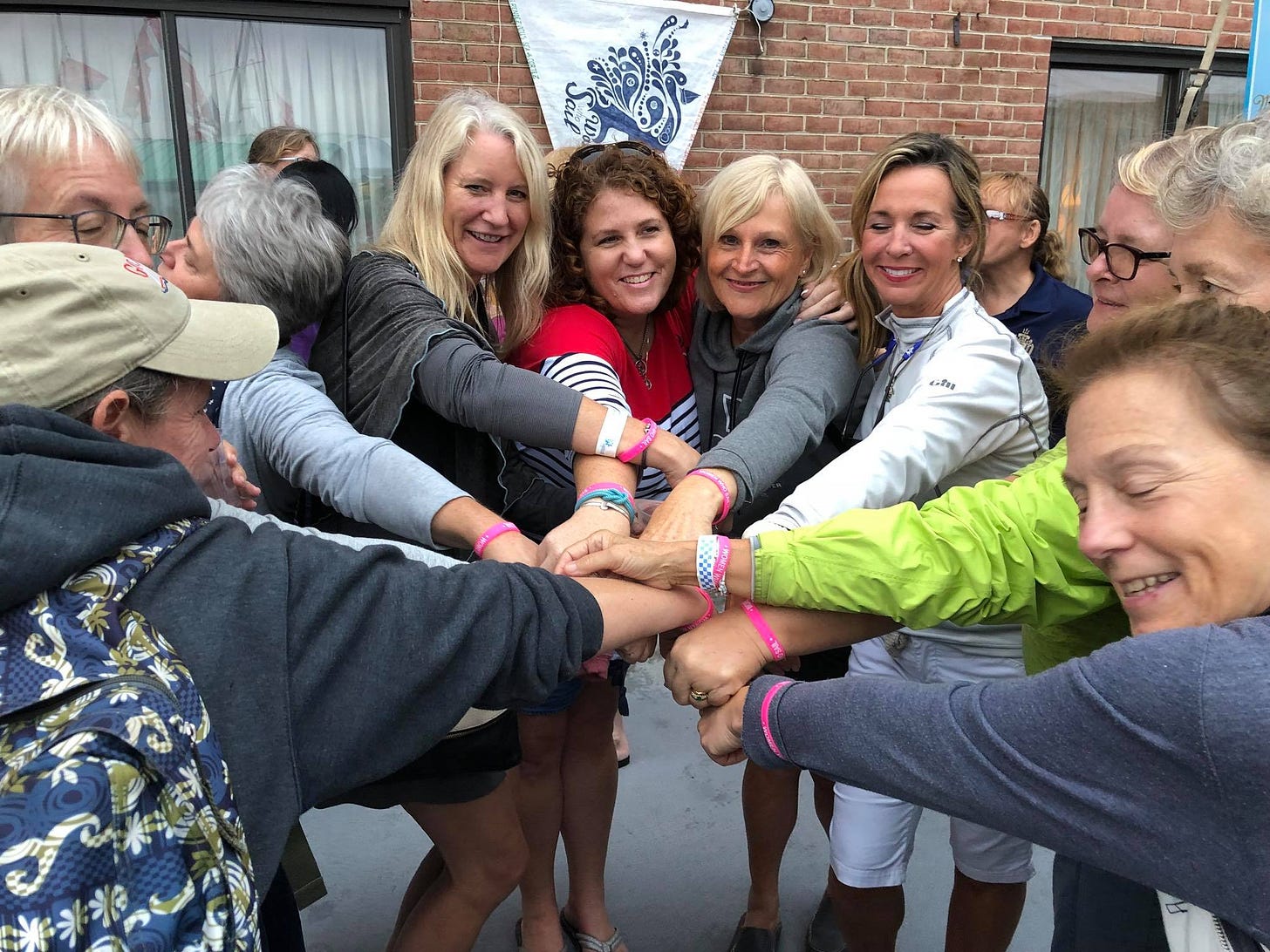 Meetup of women at Pussers in Annapolis showing off their WWS wristbands