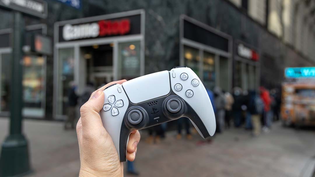 PS5 restock with a DualSense controller in hand