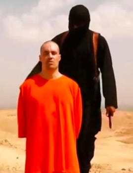 Clad in orange, Foley kneels against a sandy backdrop as a black-clad terrorist stands behind him with a knife