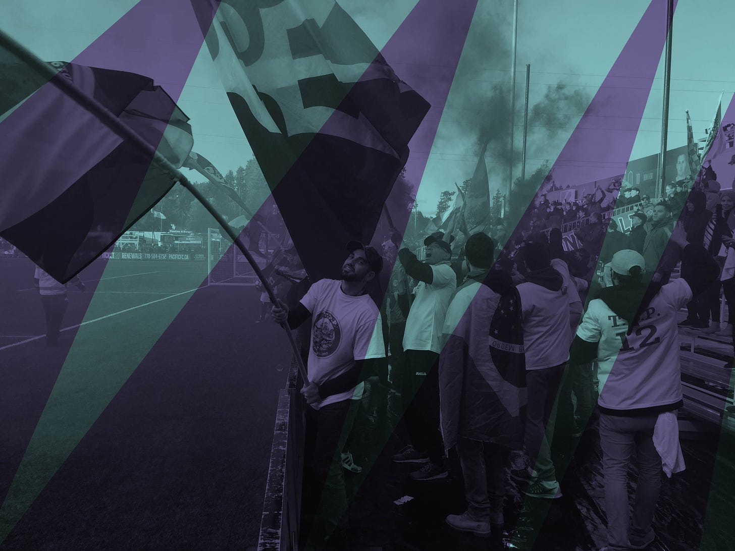 Pacific FC supporters wave flags after the club's victory.
